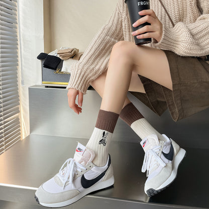 Rufia socks worn on feet highlighting the embroidered bunny design and comfortable fit