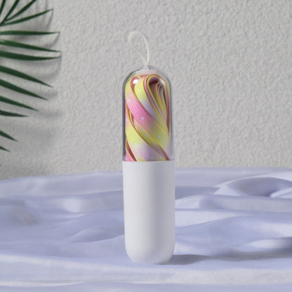 Pair of tie dye colorful dot shoe laces displayed with colorful dot pattern