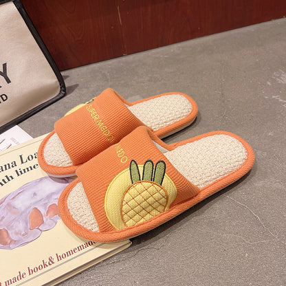 Orange Slipeer slipper with detailed stitching and fruit motif on fabric
