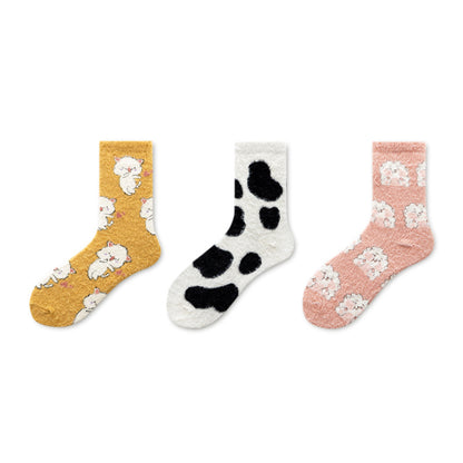 Model wearing Rufia fleece socks with casual shoes in a cozy indoor setting