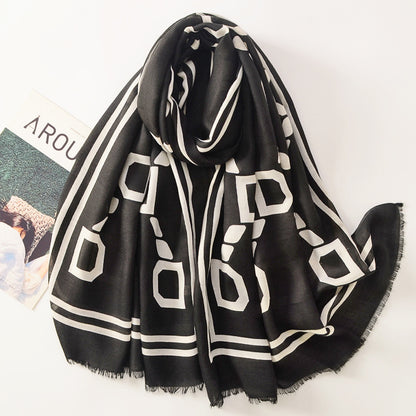 Scarvii Letter D long scarf in natural light highlighting fabric details