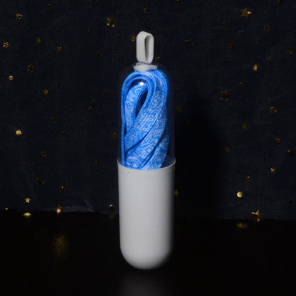 Pair of paisley shoe laces with metal aglets visible on ends