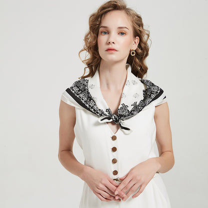 Model wearing Scarvii Geometry Scarf Head Wrap tied at the back with visible geometric print