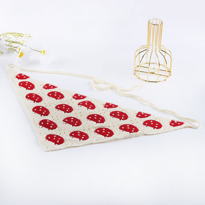 Woven vintage hairband placed on wooden surface with natural lighting