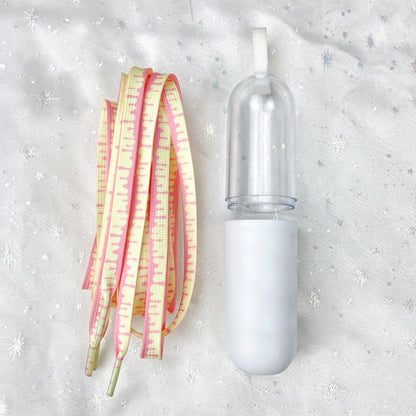 Cream colorful shoe laces, 55" length, pink and yellow accents